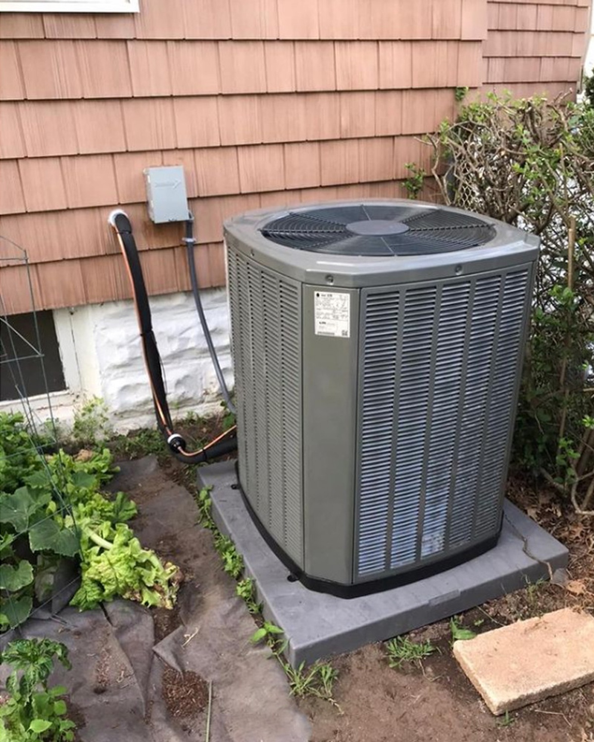 Service van parked outside customer home with AC