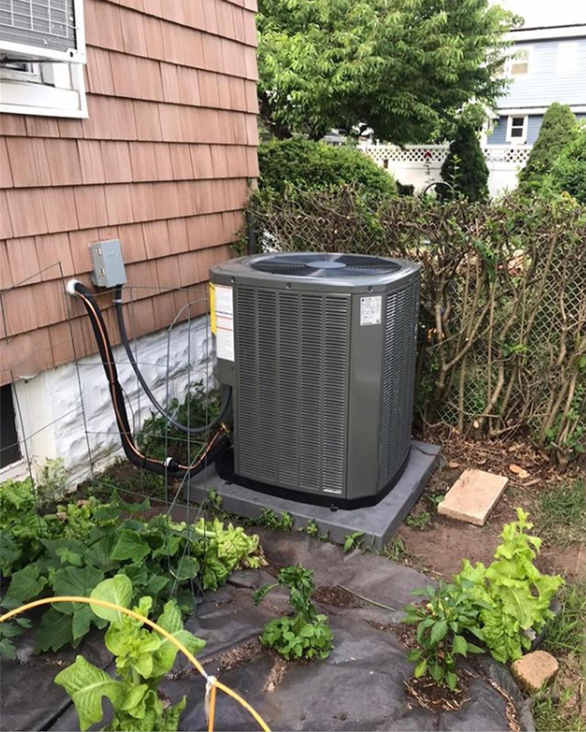 Service van parked outside customer home with AC