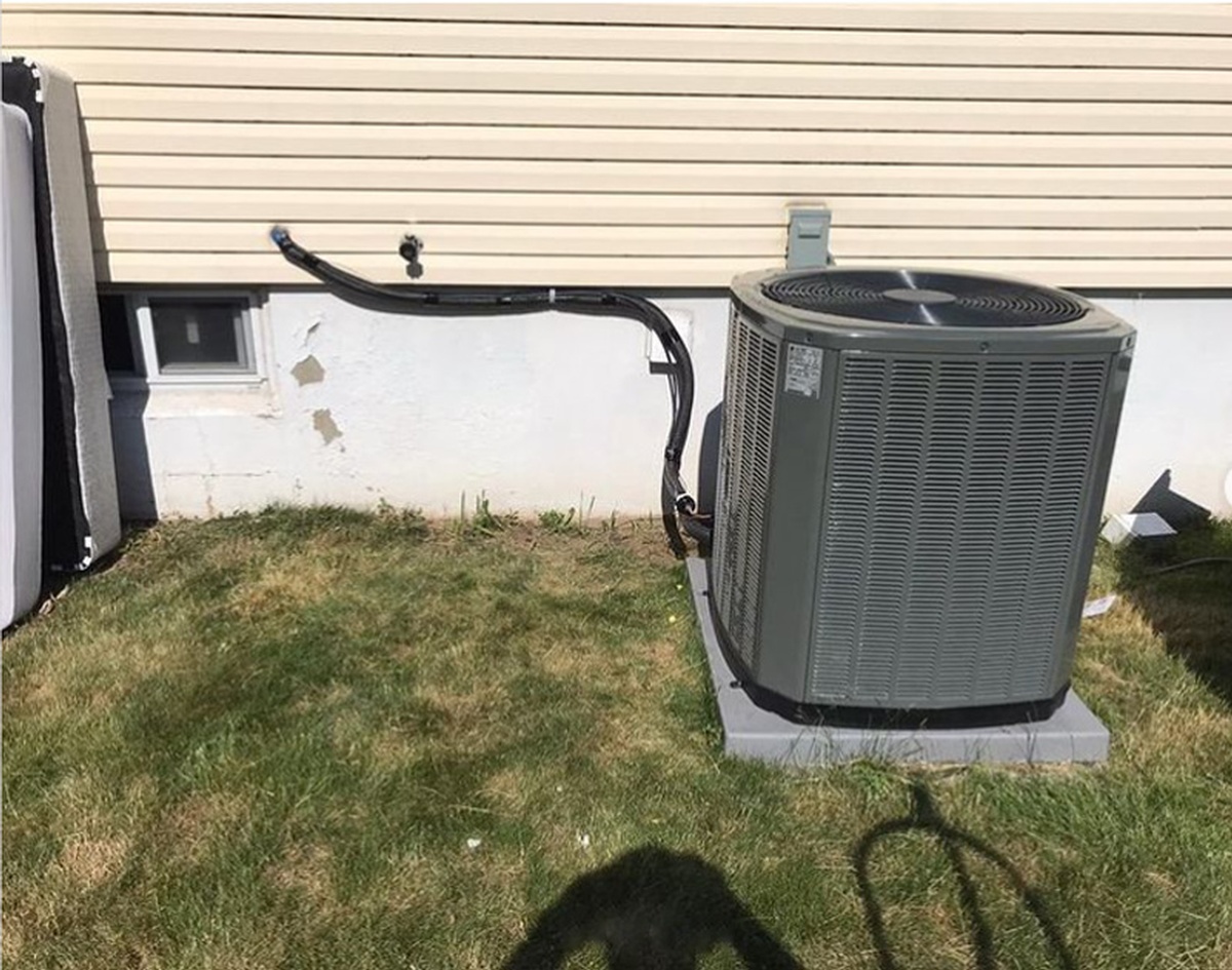 Service van parked outside customer home with AC