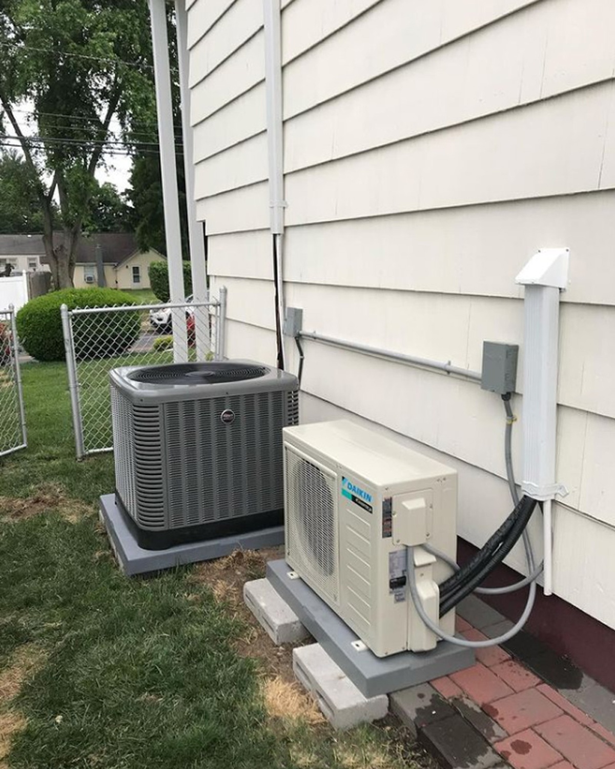 Technician cleaning AC blower indoors