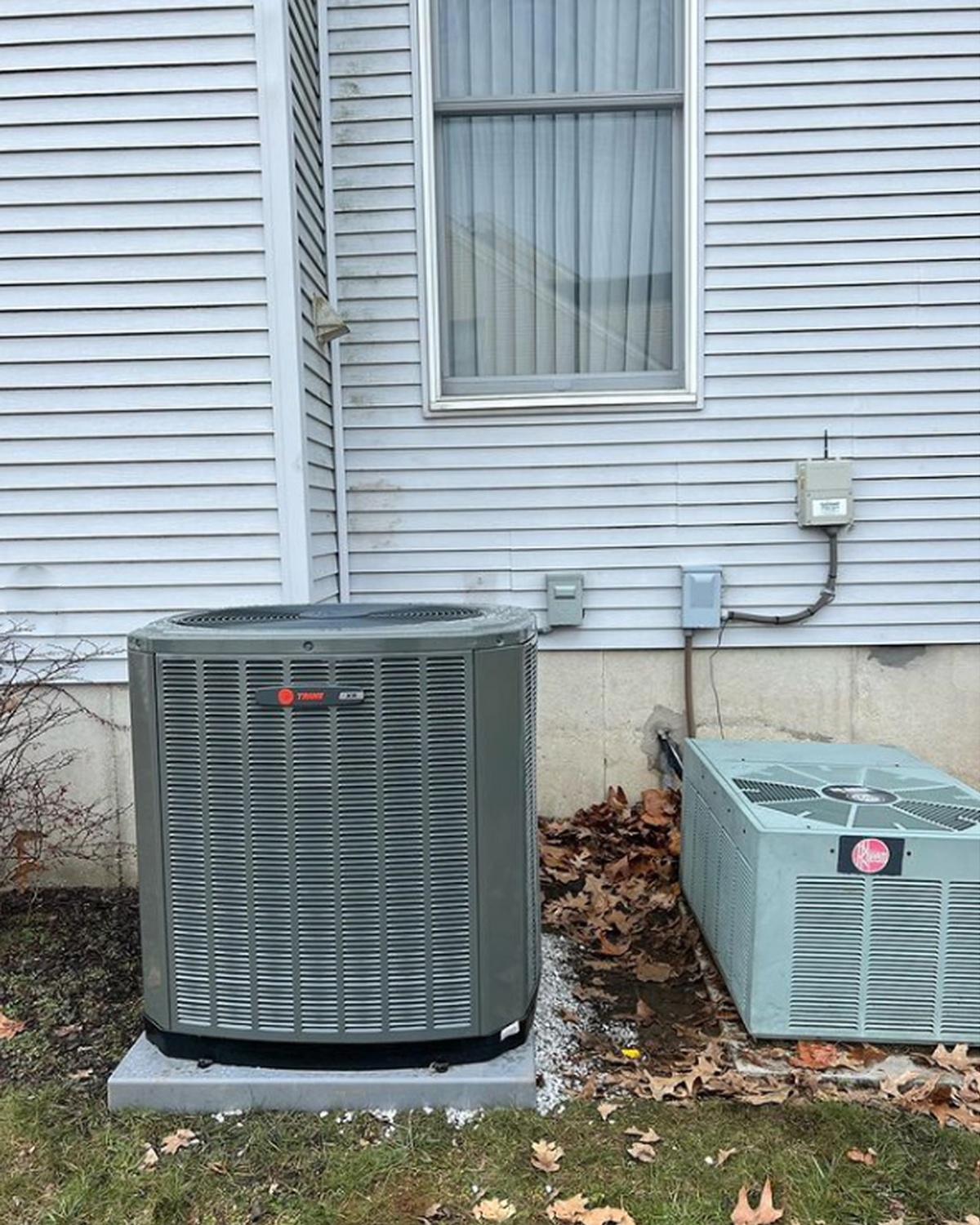 HVAC technician installing thermostat controller indoors
