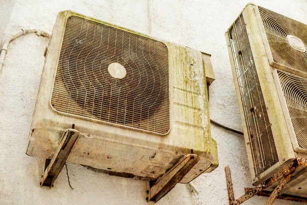 Two air conditioning units are mounted on a wall, providing cooling for the room.
